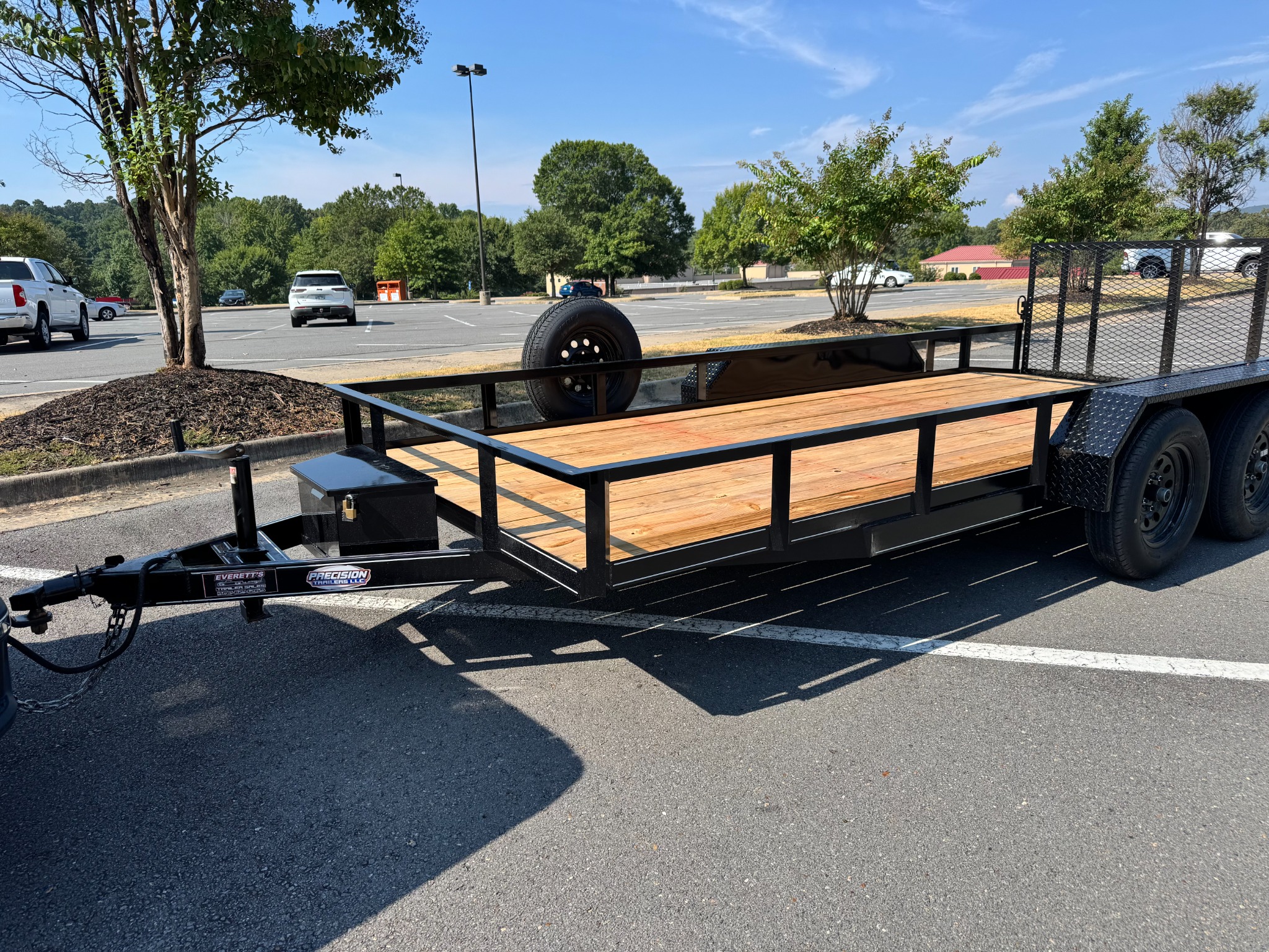 Precision tandem utility trailer with wood deck and rear loading gate